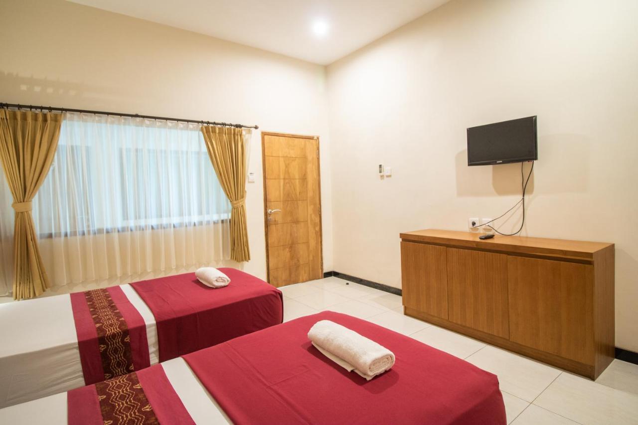 Kuta Suci Guesthouse Esterno foto