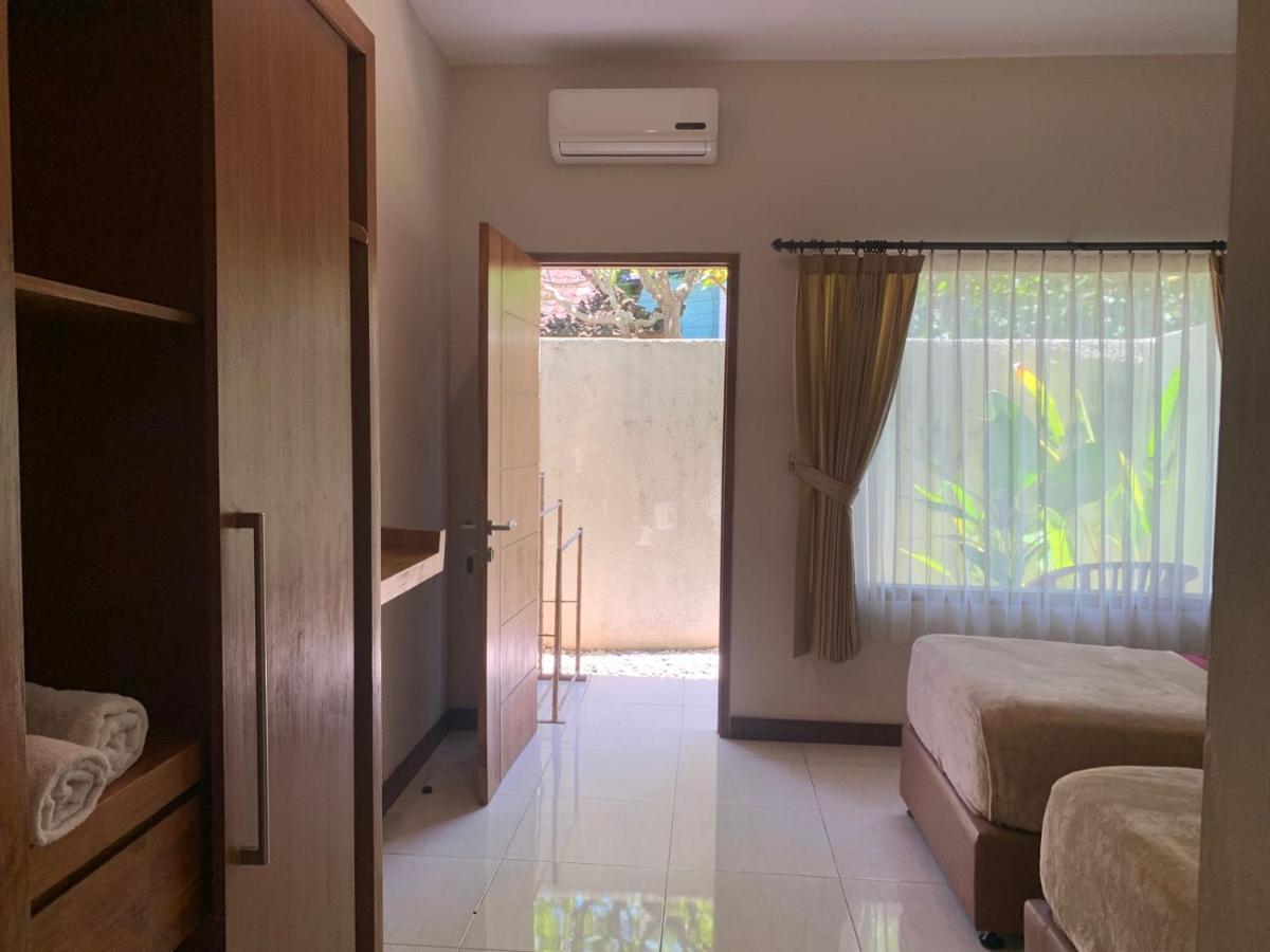 Kuta Suci Guesthouse Esterno foto